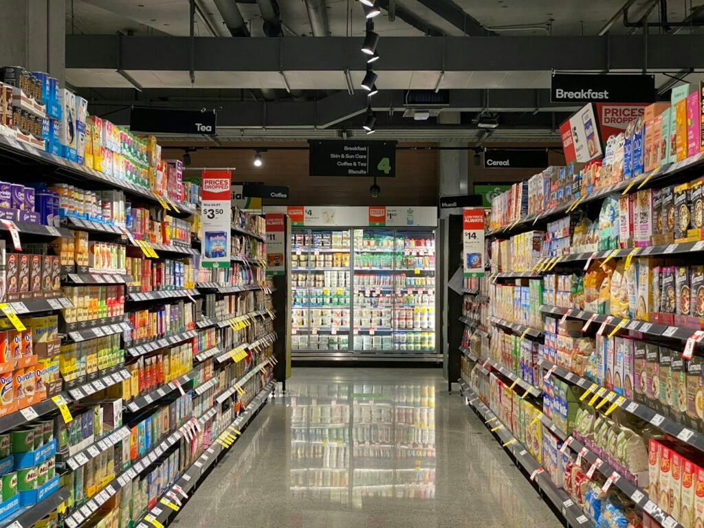 Grocery store aisle with stocked shelves